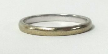 A 9ct white gold wedding band, finger size M.