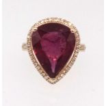 A 14ct yellow gold and diamond ring set with a pear cut ruby, approx 9ct, diamonds approx 0.50ct