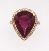 A 14ct yellow gold and diamond ring set with a pear cut ruby, approx 9ct, diamonds approx 0.50ct