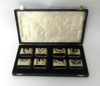 A set of 8 silver napkin rings by Sandra Poulton each pierced with animal, bird and flower