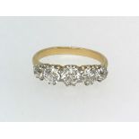 A five stone diamond ring, set in yellow gold, finger size O.