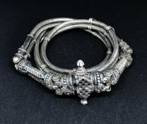 A two row chevron patterned circular rope style belt, 20th Century, with silver spacers and