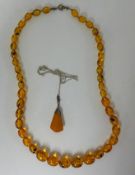 An amber necklace and pendant.