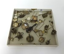 A collection of continental silver miniature items including a cello, flat irons, salver, tea bowls,