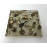 A collection of continental silver miniature items including a cello, flat irons, salver, tea bowls,