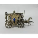 A miniature silver continental (possibly German) table salt in the form of a horse and carriage,