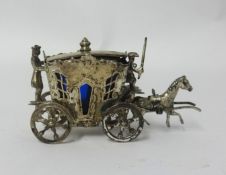 A miniature silver continental (possibly German) table salt in the form of a horse and carriage,