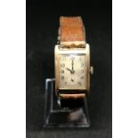 A vintage gents 9ct gold 'tank' cased wristwatch.