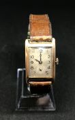 A vintage gents 9ct gold 'tank' cased wristwatch.
