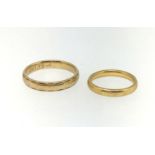 A 22ct gold wedding band, approx 4.2gms, finger size M and a 9ct gold wedding band, finger size V (