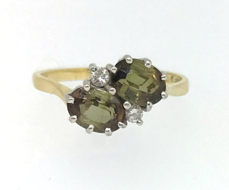 An 18ct diamond and tourmaline set ring.