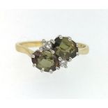 An 18ct diamond and tourmaline set ring.