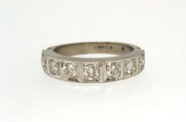 A white gold half hoop seven stone eternity ring, finger size P.