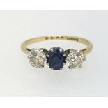 A diamond and sapphire three stone ring.