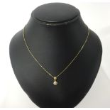 A 9ct gold necklace, with a diamond set pendant.