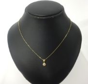 A 9ct gold necklace, with a diamond set pendant.