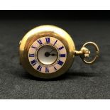 An 18ct gold miniature half hunter pocket watch, the back plate No.100677, with mother of pearl