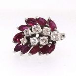 A good ruby and diamond ring set with an arrangement of eight round cut diamonds in a form of a
