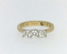 An 18ct three stone diamond ring.