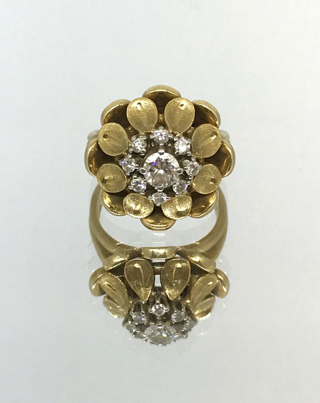 A 1950's 18ct gold and diamond set ring.