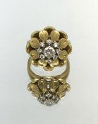 A 1950's 18ct gold and diamond set ring.