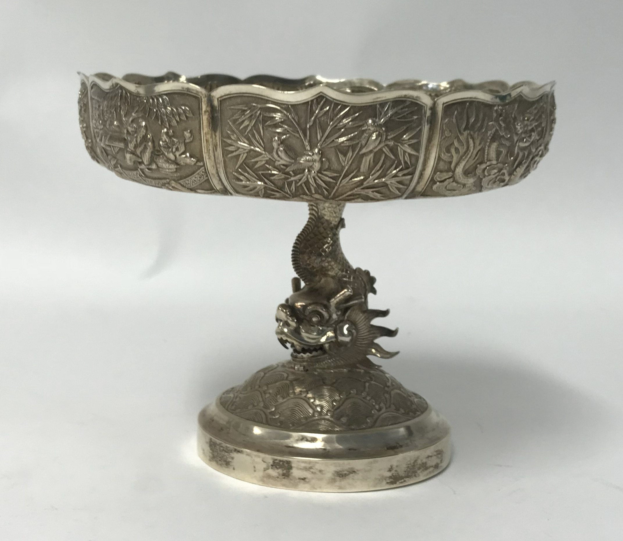 Chinese Export Silver, a comport richly decorated with panels of dragons, birds on branches and