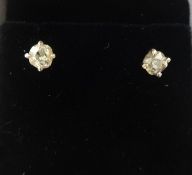 Two pairs of diamond set ear studs.