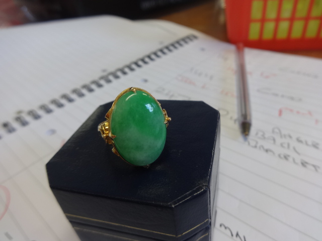 A 22ct gold large oval jade ring, finger size Q. - Image 2 of 2