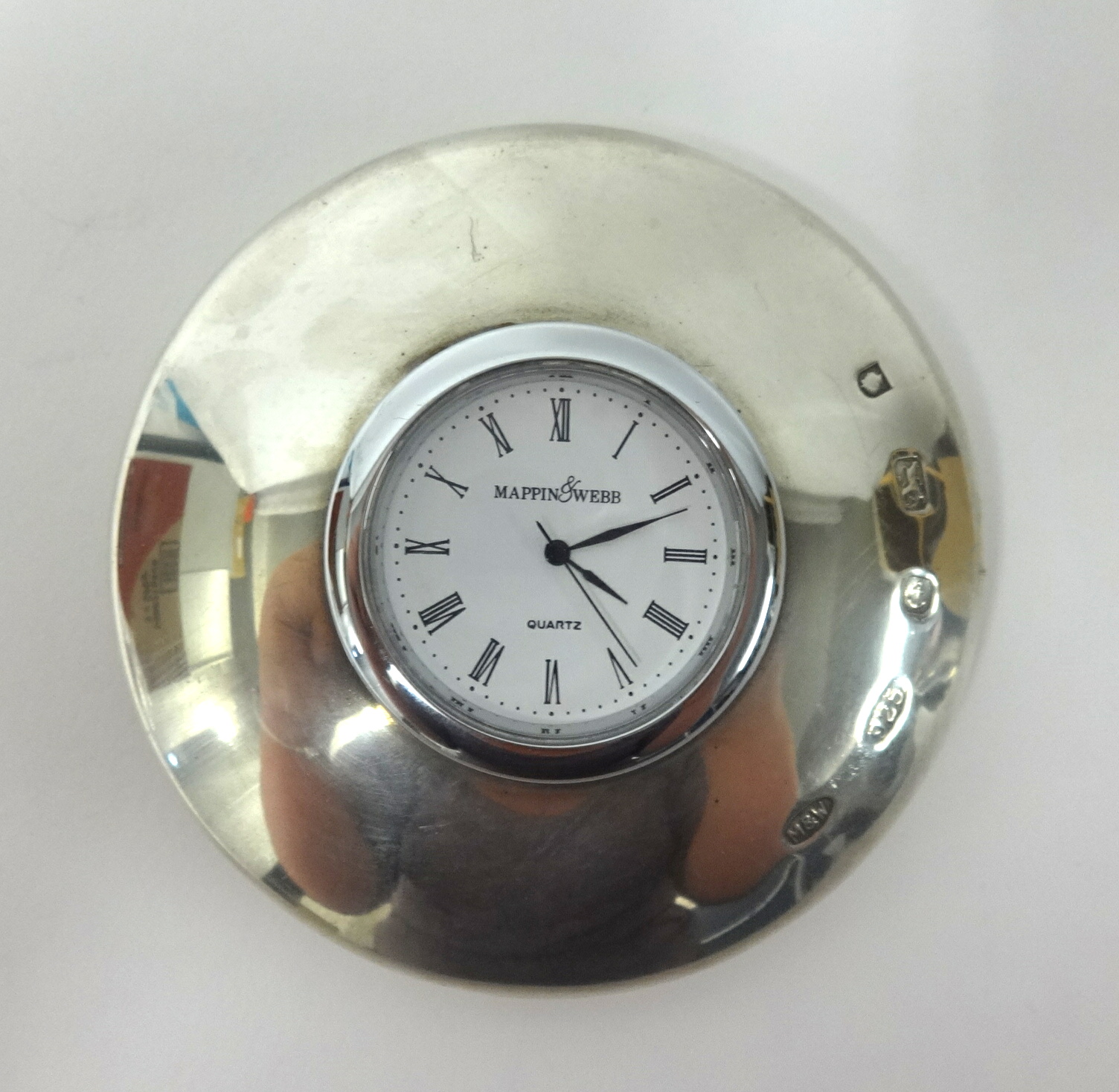 Mappin and Webb, a modern silver clock paperweight.