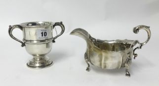 A Geo V silver twin handled cup (W.N Ltd) together with a silver sauce boat marked Thomas (2),