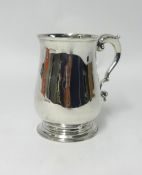 A George III silver and baluster shaped tankard with acanthus decorated scroll handle, underside