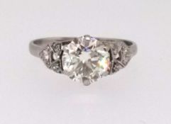 A fine diamond ring set with a good centre stone of approx 1.75cts with further diamonds to the