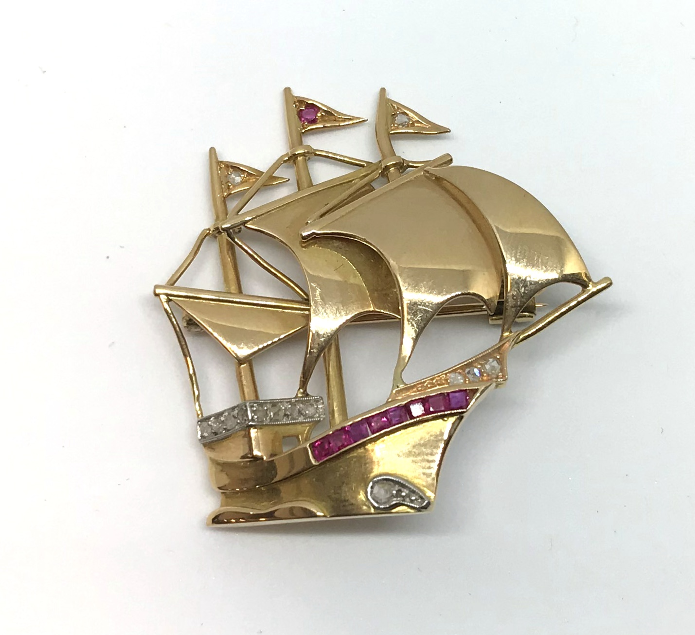 An 18ct ruby and diamond galleon brooch.