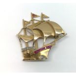 An 18ct ruby and diamond galleon brooch.