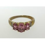 A 9ct pink gem stone ring, finger size K.