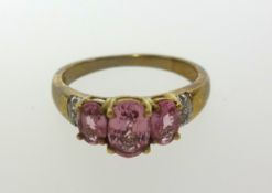 A 9ct pink gem stone ring, finger size K.