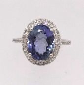 A 14ct white gold and diamond ring set with an oval cut tanzanite approx 3.57ct, diamonds approx 0.
