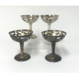 Four Mexican silver pierced decorated cups, approx 5.89oz.