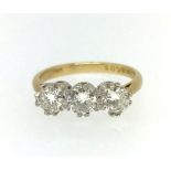 An 18ct three stone diamond ring, approx 1.50ct, finger size O.