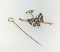 An antique bar brooch with gem set butterfly, together with a pearl stock pin.
