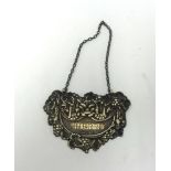 A silver sherry label of ornate design, marked P.H.V and Co, approx weight 20.3gms.