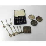 A set of six silver coffee spoons (T.B & S) in fitted case, three silver coasters and sundry