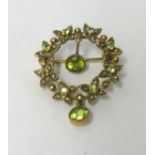 A 9ct gold flower design peridot and pearl drop brooch, approx 5.40gms.