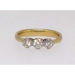 A 18ct diamond three stone ring, stamped 750, .33, finger size O.