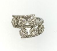 An impressive 18ct white gold double band diamond cluster ring, stamped .750, finger size M/N.