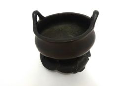A Chinese bronze censer and stand, height excluding stand 10cm, diameter 14cm,
