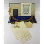 Of Masonic interest, an apron, gloves, booklet and also a silver caddy spoon.