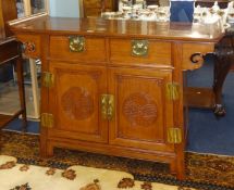 A 20th Century Chinese rosewood 'Alter' style cupboard.