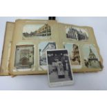 An early 20th Century postcard album, various family naval documents W.J Tooley, Stoker, Devonport