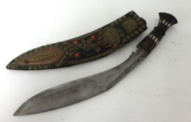 Khukri with ornate jewelled scabbard.